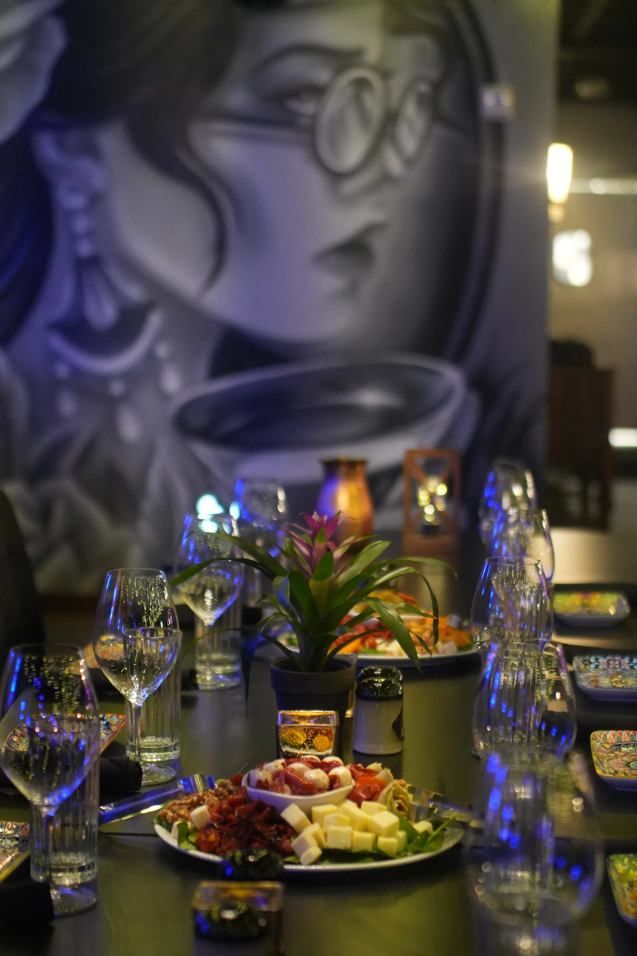 Set tables for a private dinner under the indigo goddess mural at Brooklyn's.