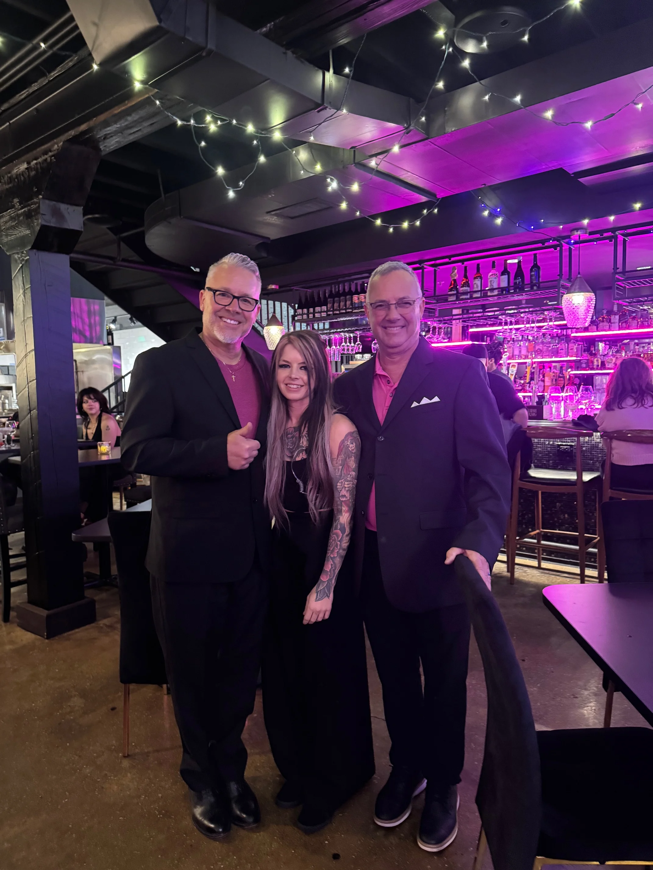 Brandi, the owner of Brooklyn's, with her father and uncle at the bar.